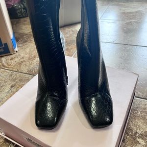 Black booties never worn , 4 .5 inches very comfortable.